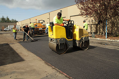 Photo of roller over freshly paved asphalt